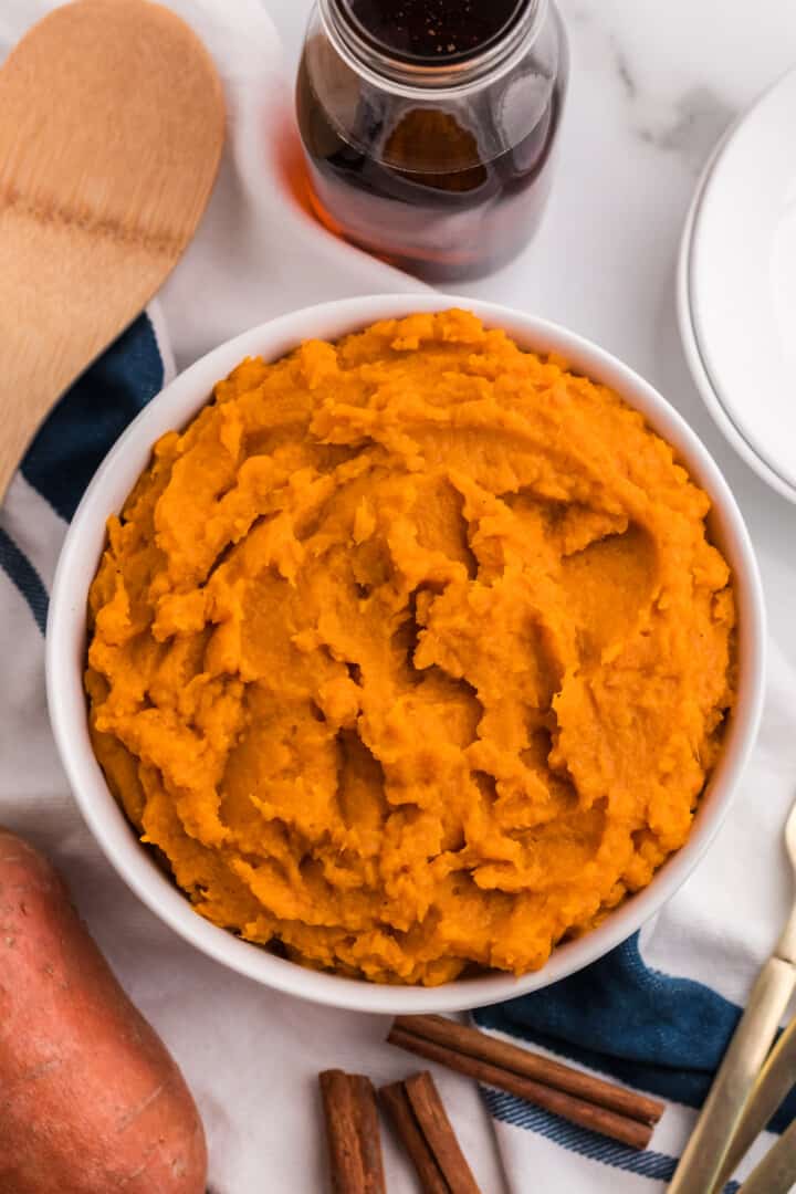 Mashed Sweet Potatoes in large white bowl for serving.