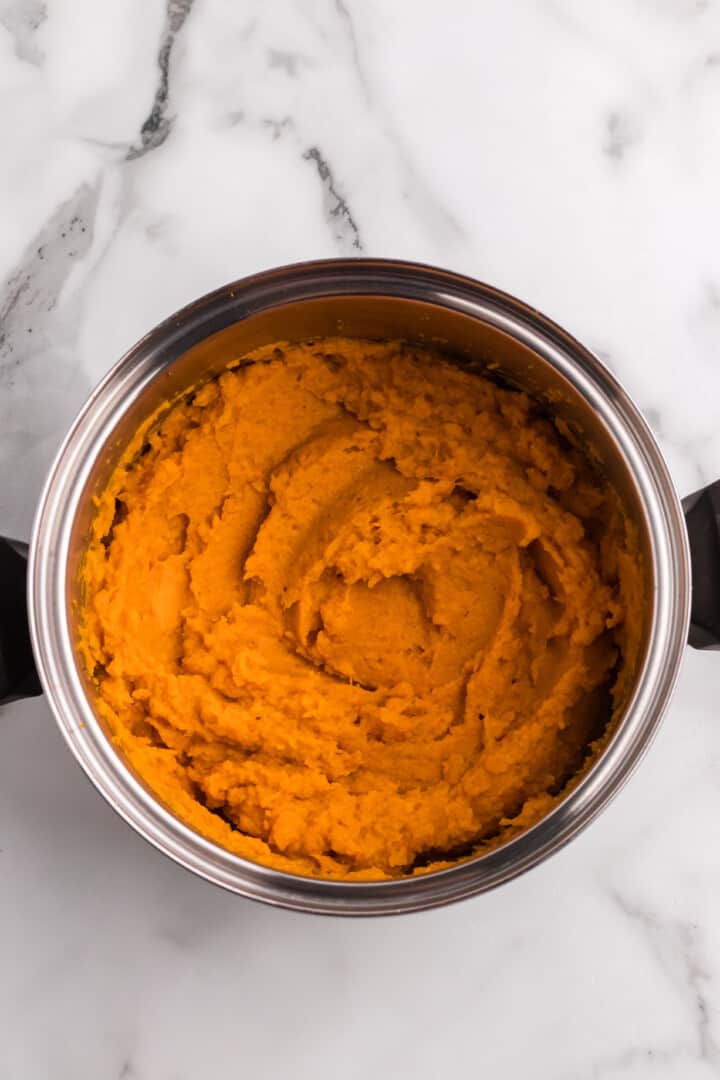 sweet potatoes mashed in large pot.