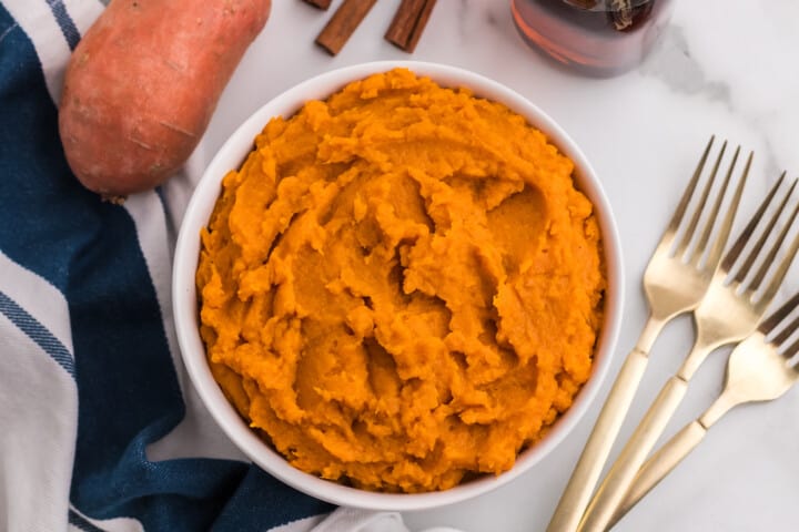 mashed sweet potatoes in a white bowl.