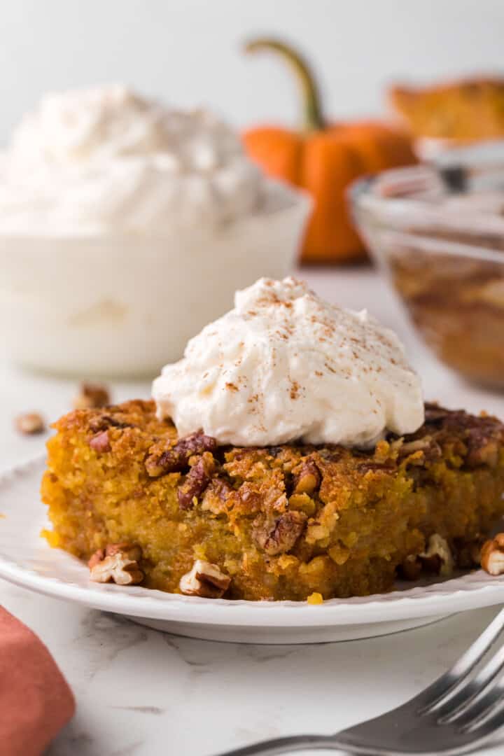 slice of pumpkin crunch cake on white plate.