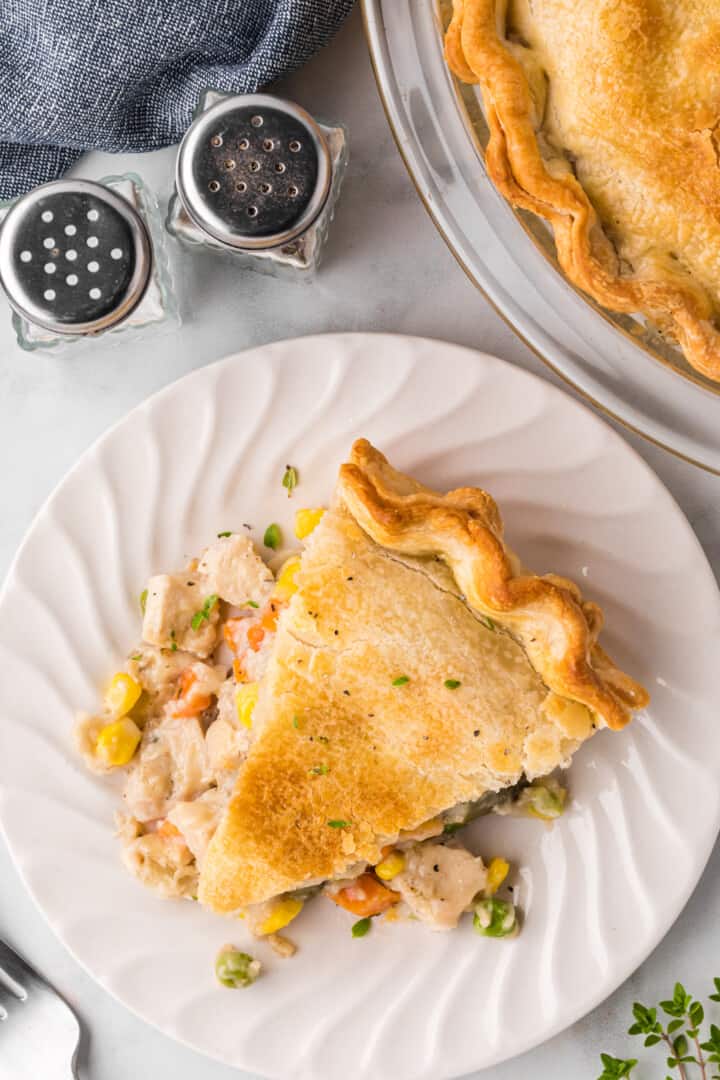 slice of the turkey pot pie served on a white plate.