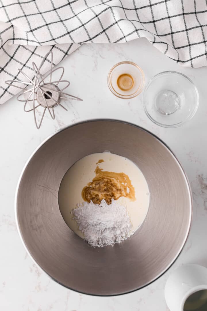 ingredients for whipped cream in a large bowl.