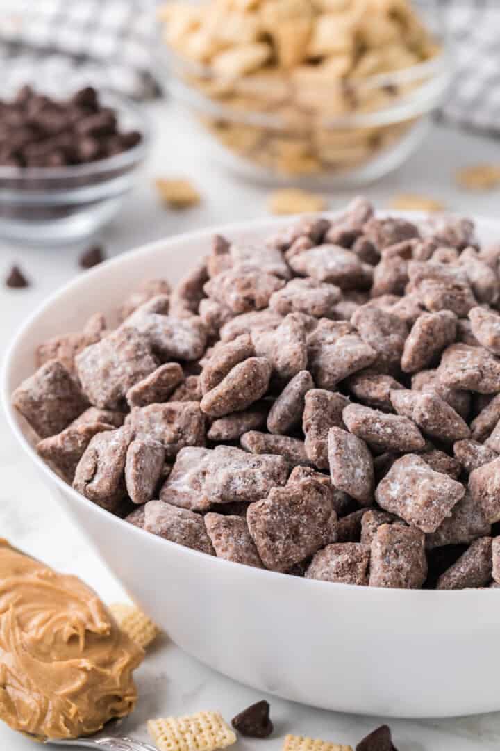 closeup of Muddy Buddies in a white bowl.