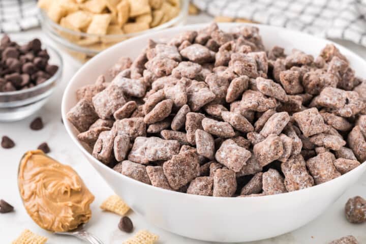 closeup of Muddy Buddies in white bowl.