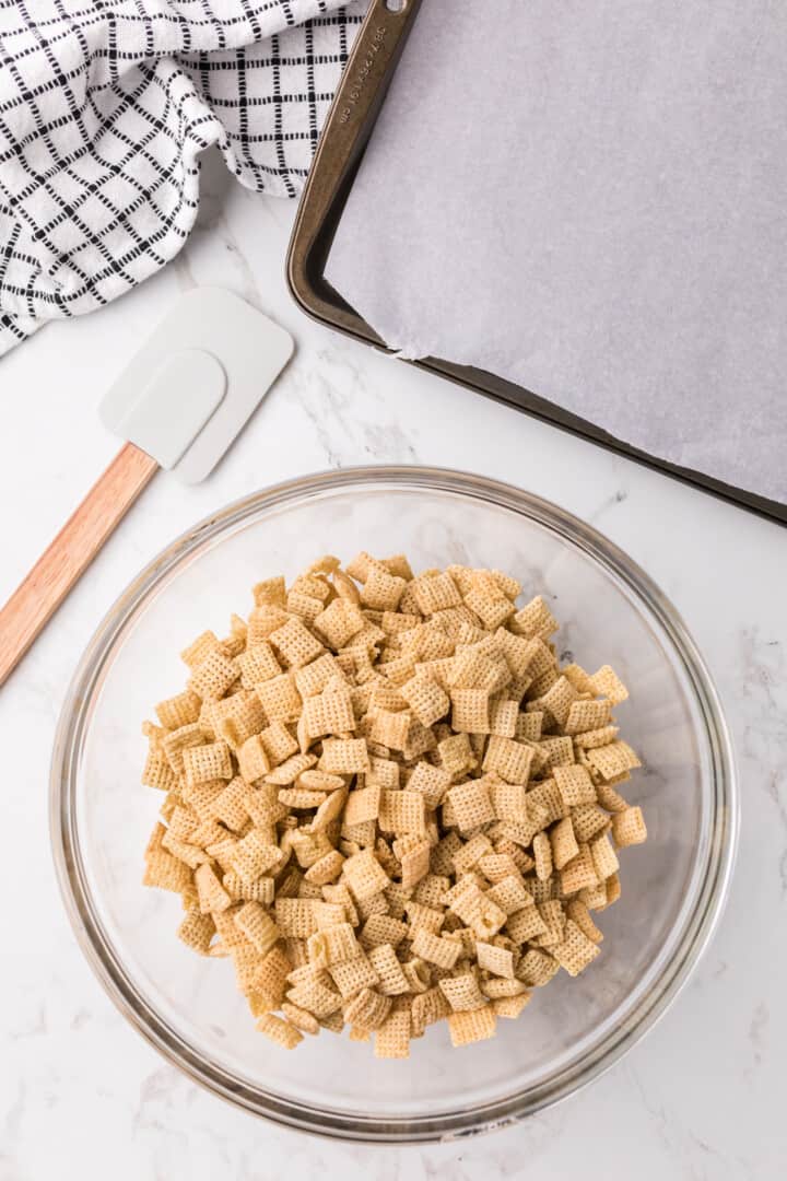 Chex cereal in large bowl for mixing.