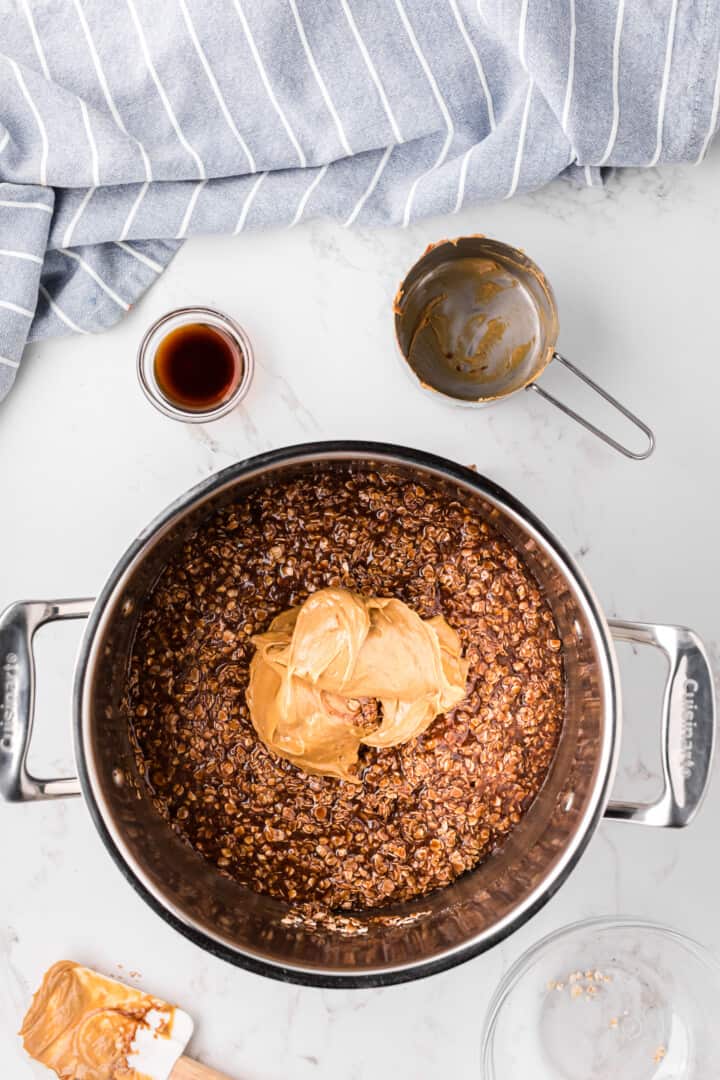 adding peanut butter to the warm pot.