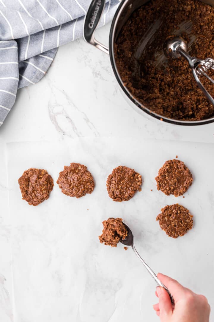 spooning out the No Bake Cookies on to parchment paper.