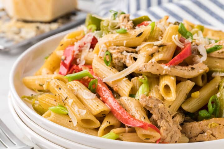 closeup of the Rasta Pasta on stacked white plates.