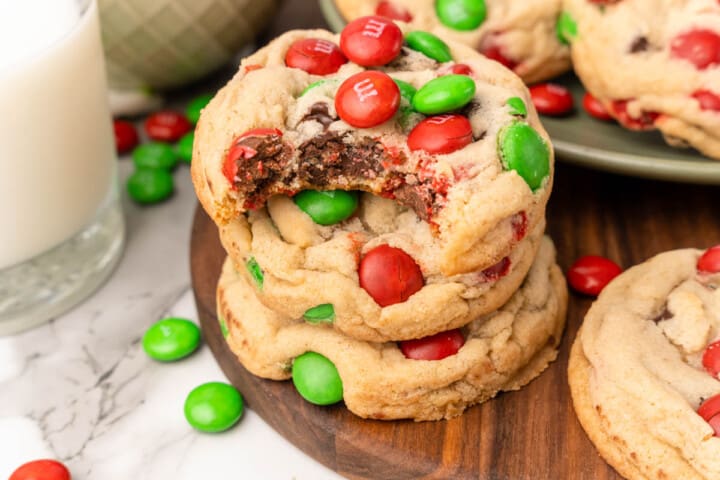 Christmas M&M Cookies stacked on top of each other.