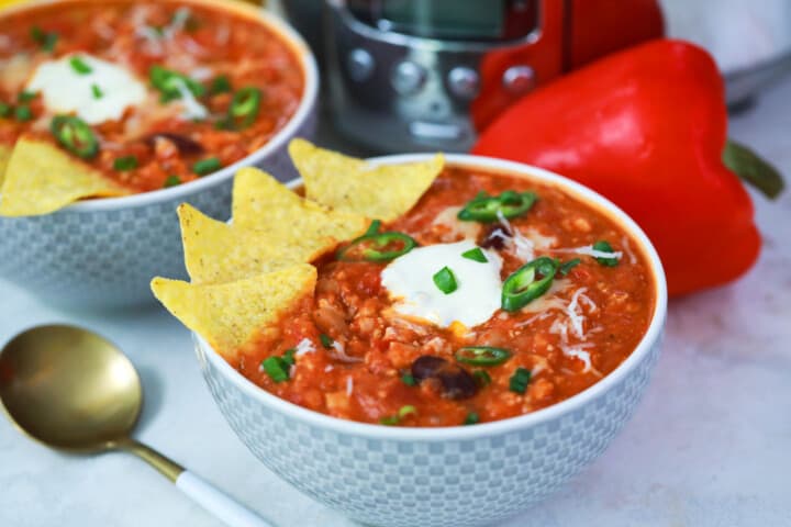 turkey chili in a bowl with tortilla chips.