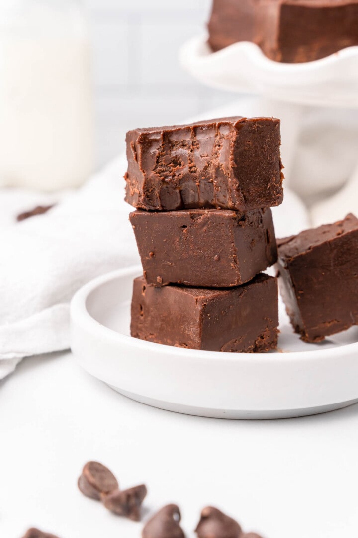 Microwave Fudge stacked on a white plate.