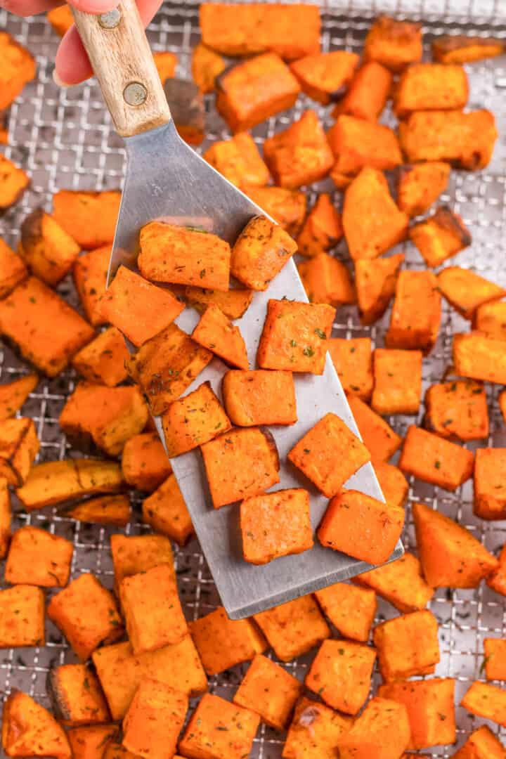 Air Fryer Sweet Potatoes on rack with serving spatula.