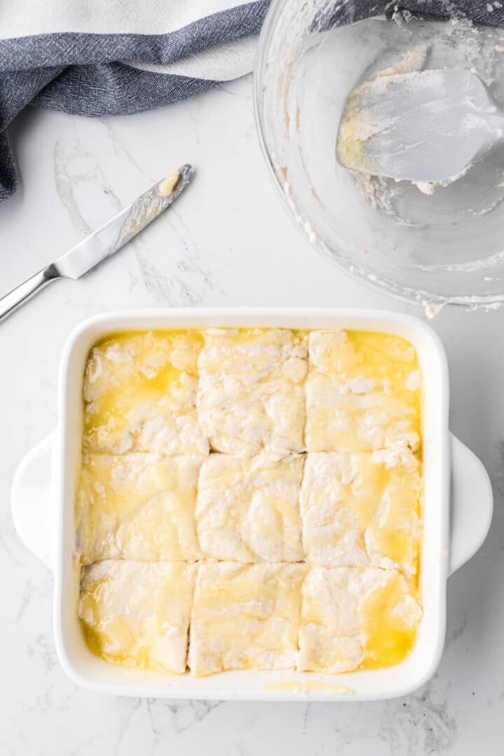 biscuit dough in the casserole dish prepared for baking.