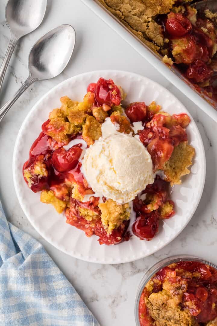 top view of Cherry Dump Cake on white plate.