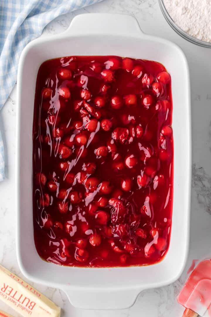 cherry pie filling on the bottom of the baking dish.