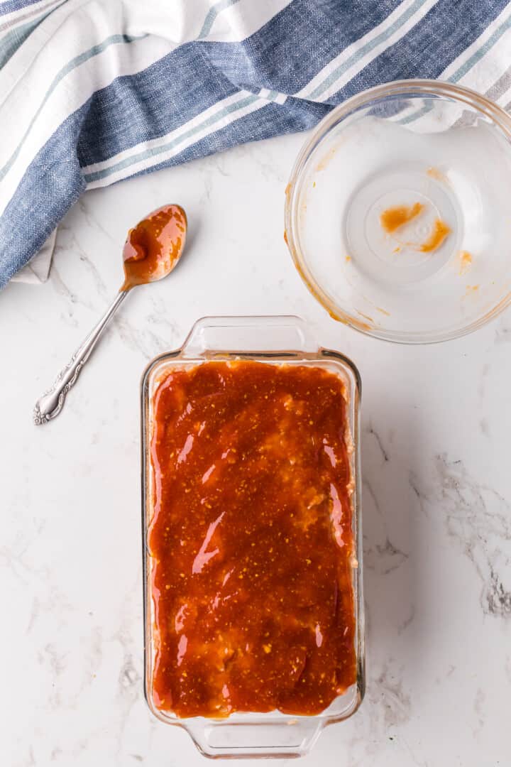 sauce spread on top of the unbaked meatloaf.