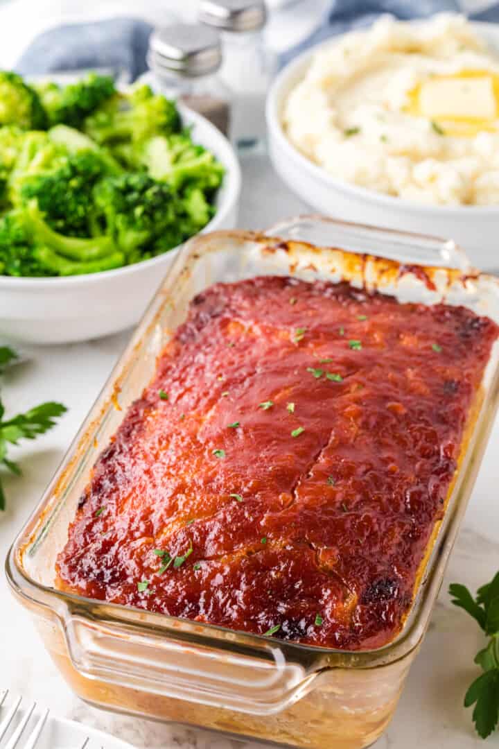 baked chicken meatloaf in glass pan.