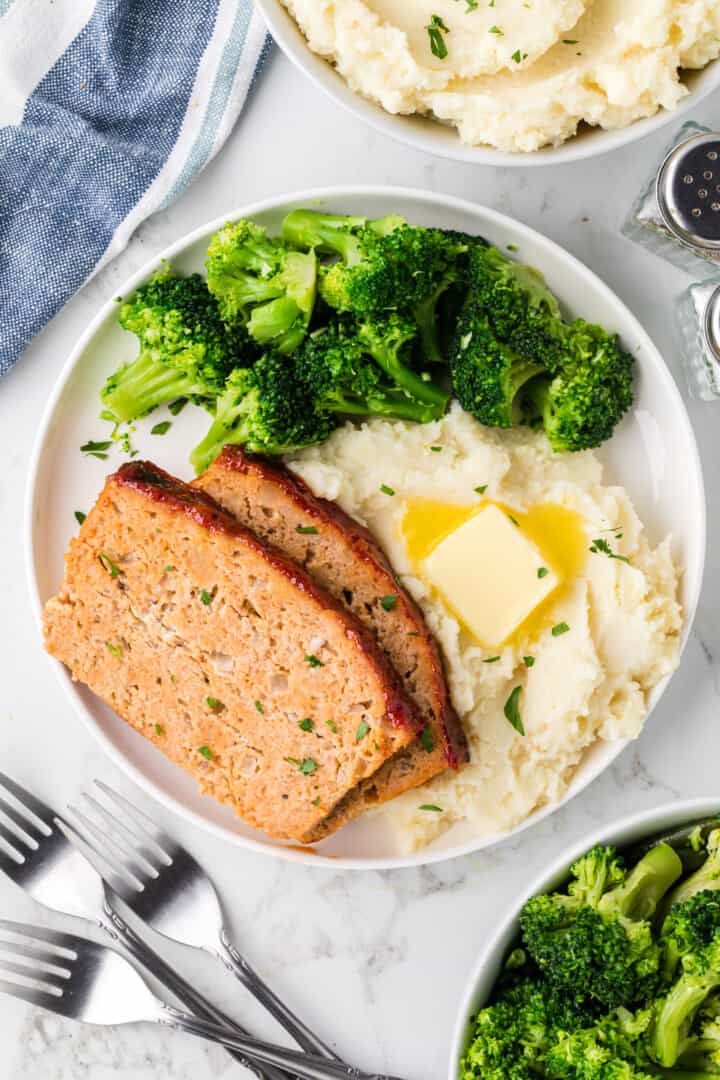 chicken meatloaf dinner on white plate.