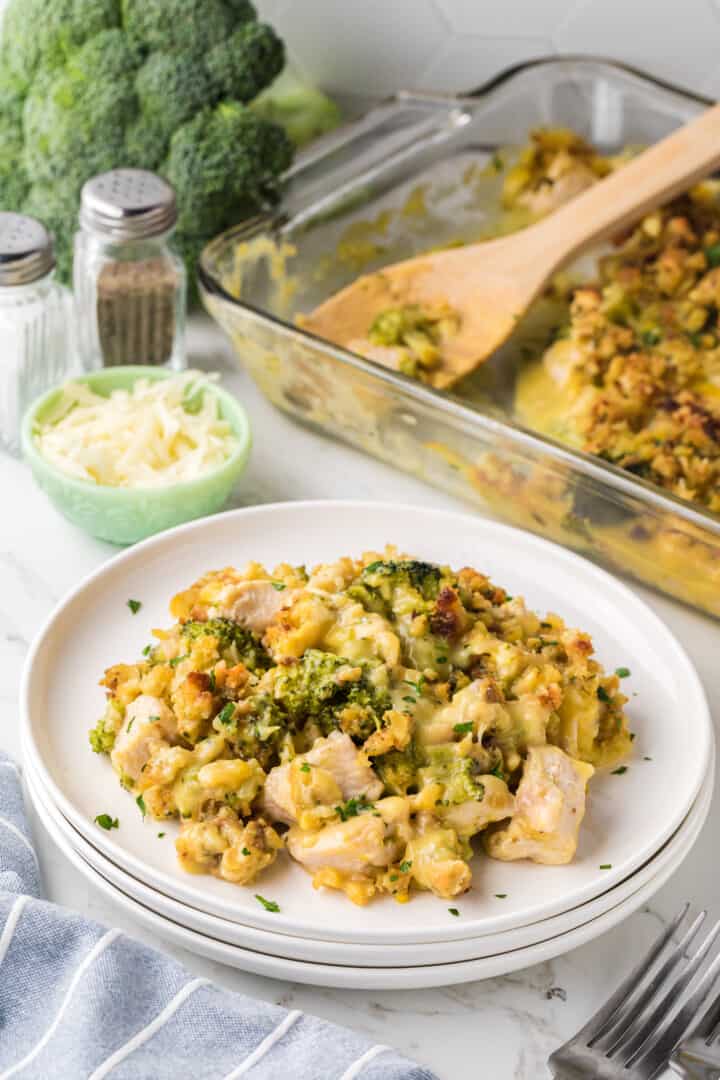 chicken stuffing casserole on stacked white plates.