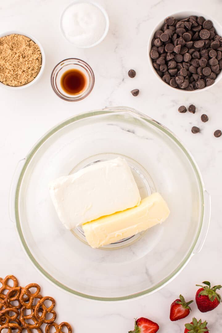 cream cheese and butter in glass bowl to start making the dip.