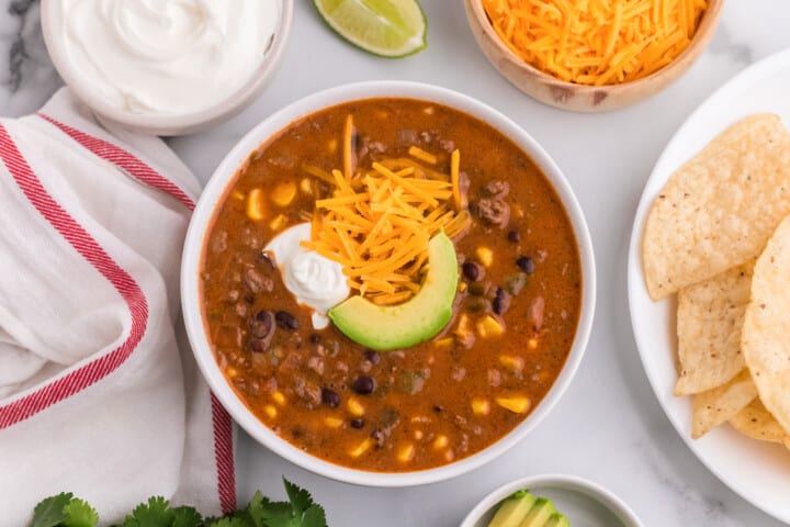 Creamy Taco Soup closeup in white bowl.