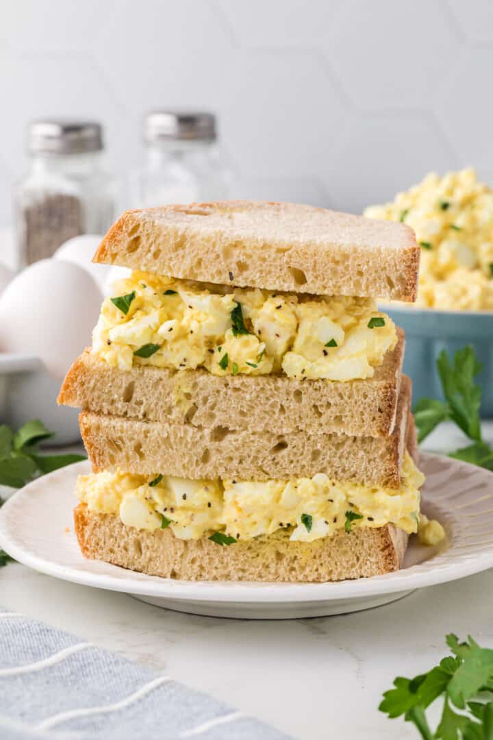 Classic Egg Salad sandwich stacked on top of each other.