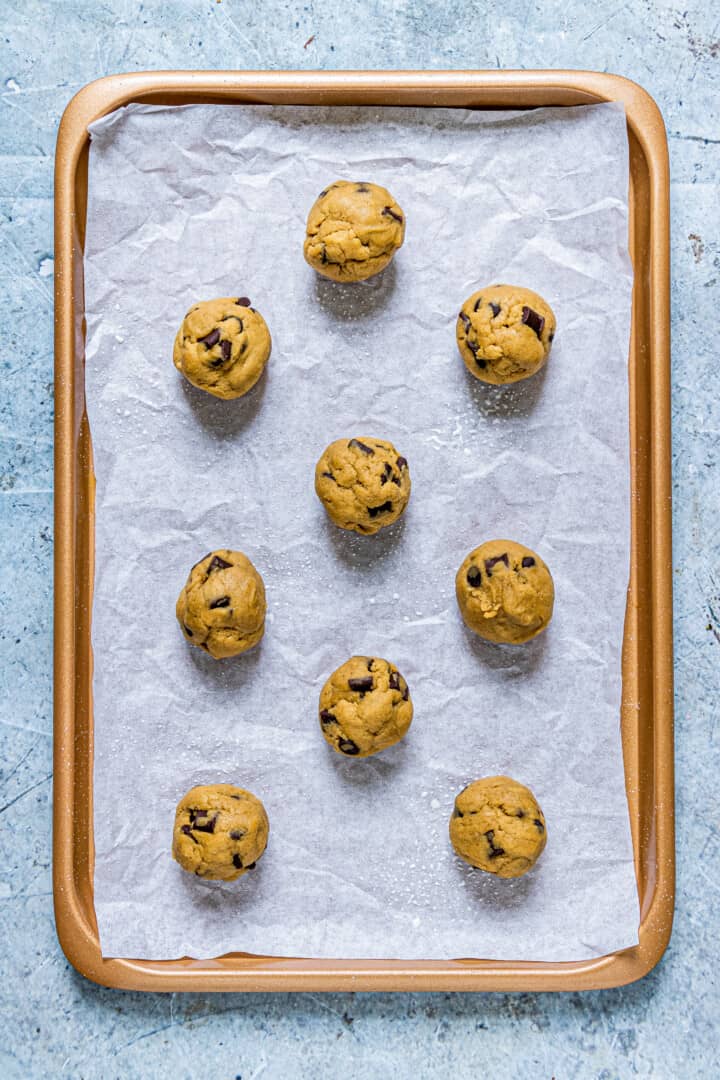 cookies dough balls on sheet pan.