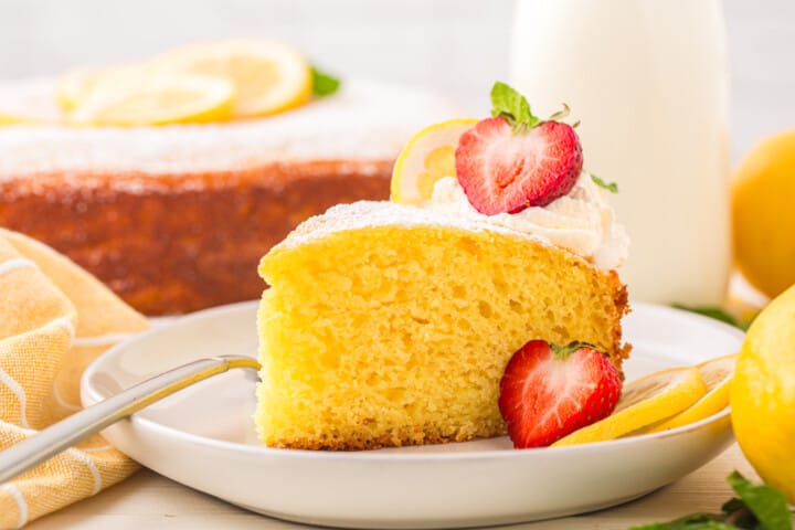 slice of lemon ricotta cake on a white plate.