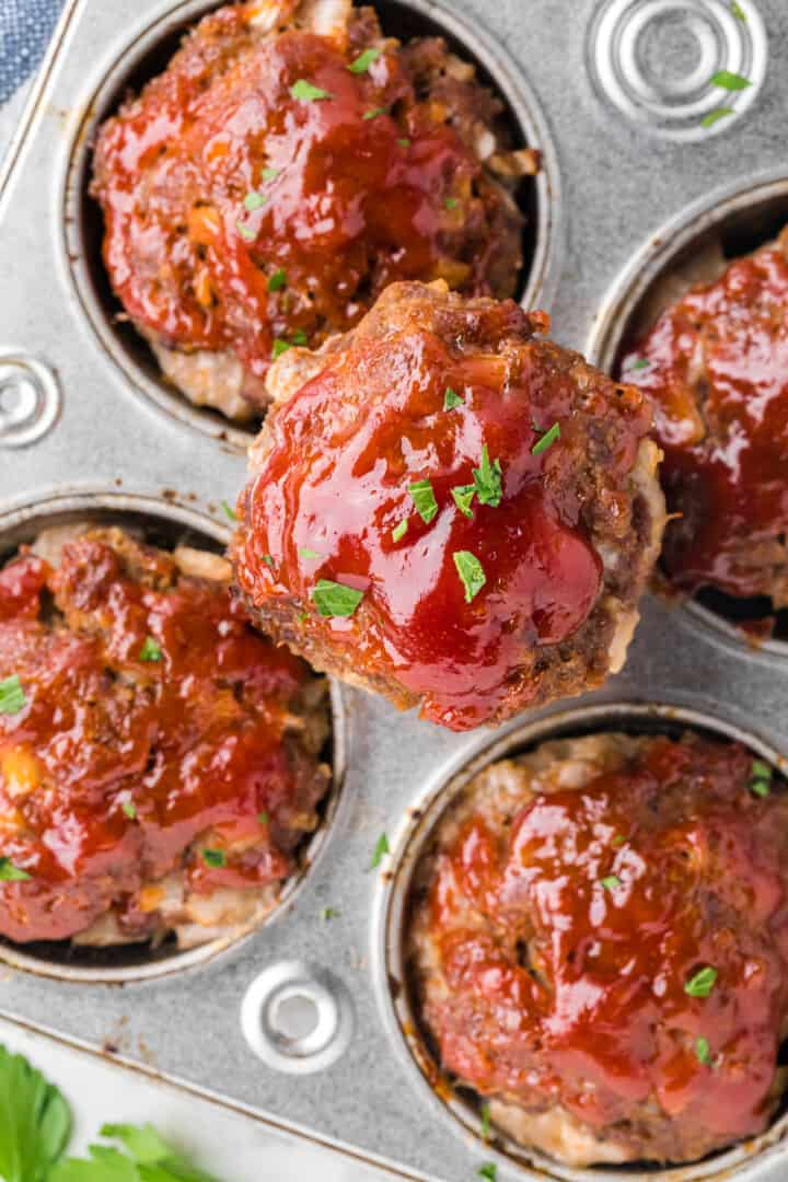 closeup of a mini meatloaf on top of the pan.