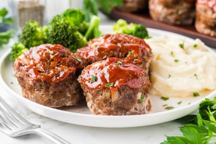 closeup of the mini meatloaf on dinner plate.