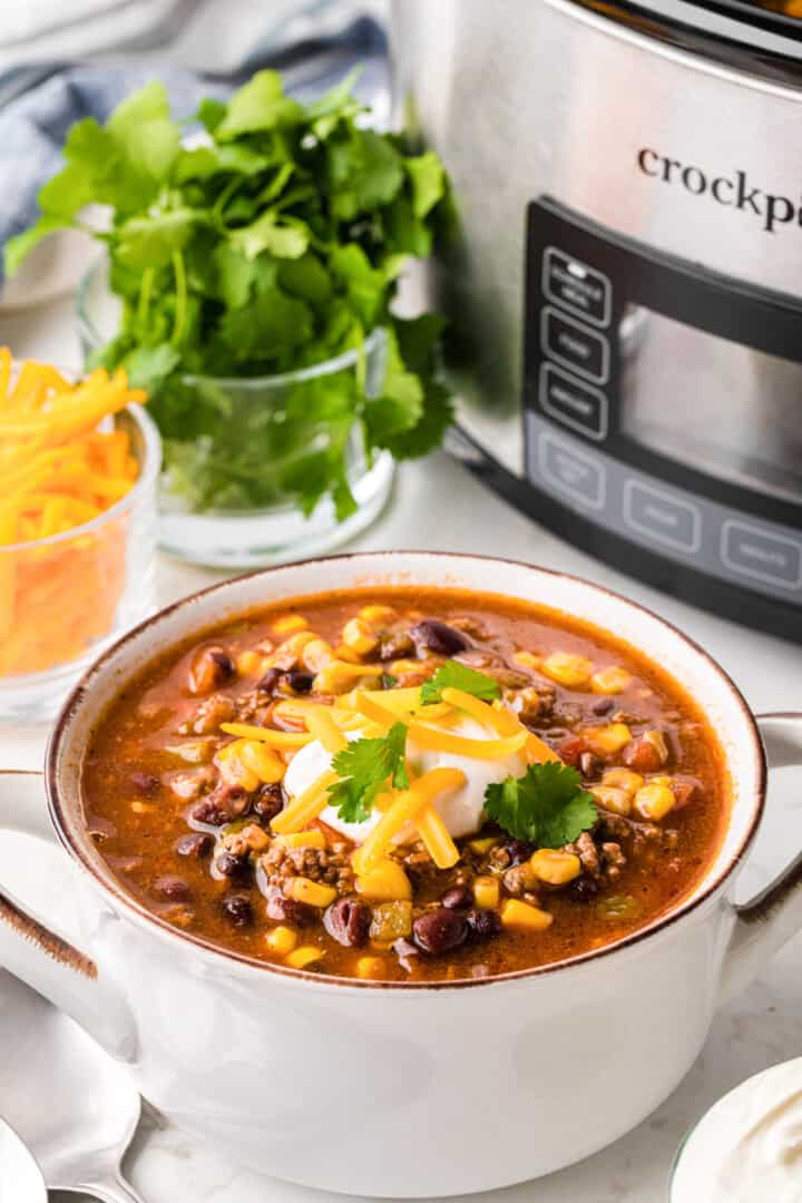 closeup of the taco soup in a white bowl.