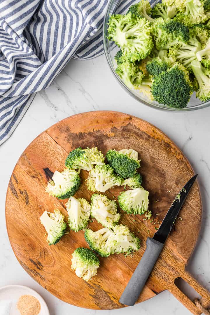 cutting the broccoli into the pieces.