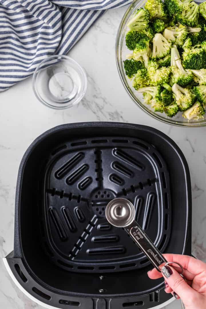 adding water to the bottom of your air fryer basket.