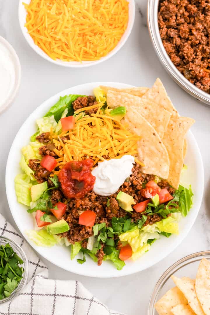 Ground Beef Taco Salad on white plate serving for dinner.