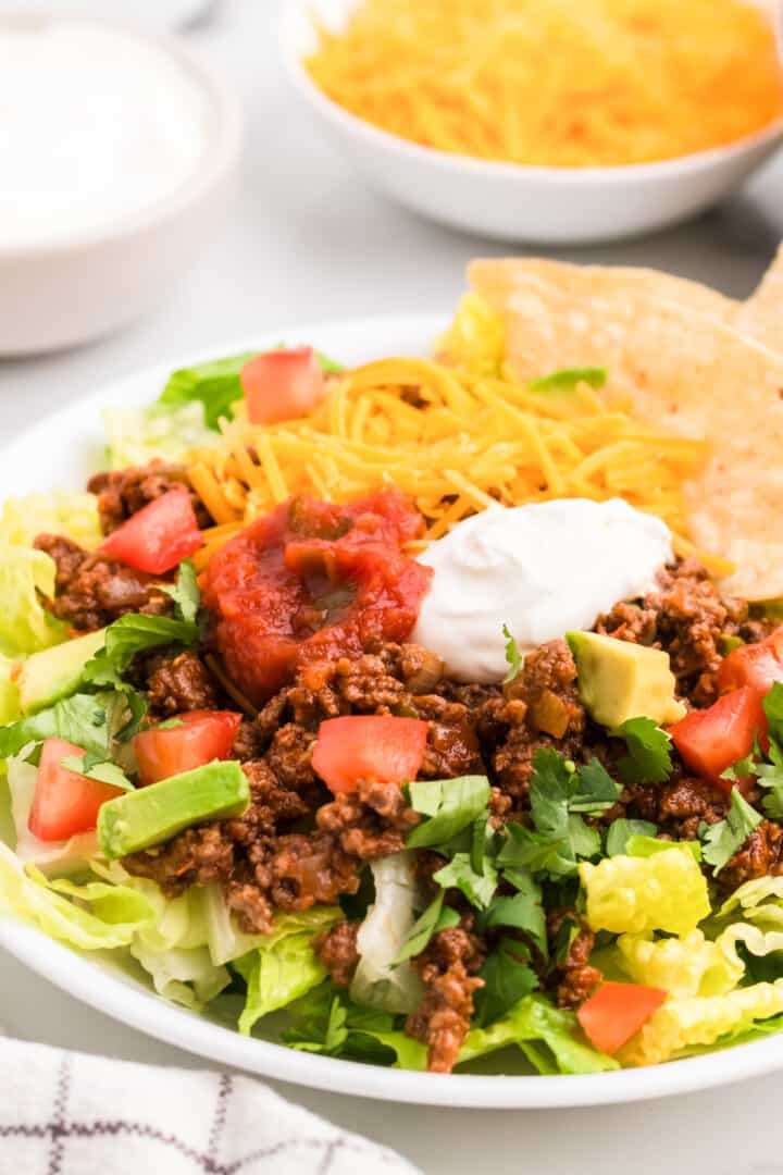 closeup of the taco salad in a white bowl.