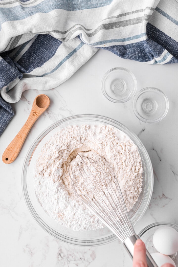 whisking the dry ingredients to sift together.