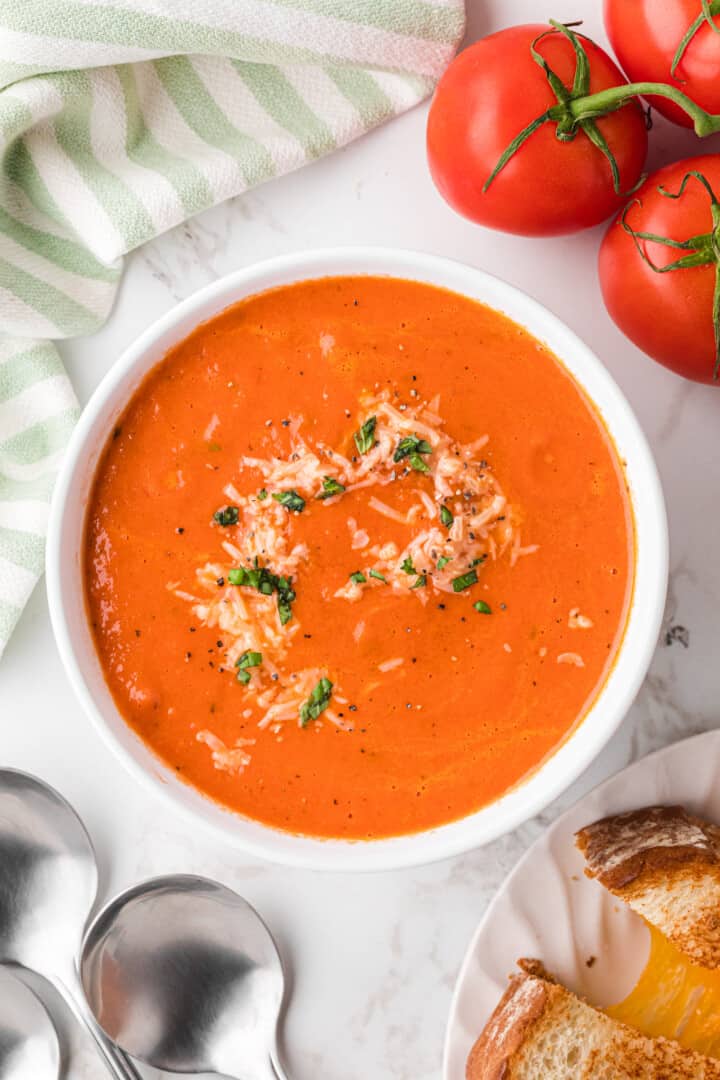 Slow Cooker Tomato Soup served in a white bowl.