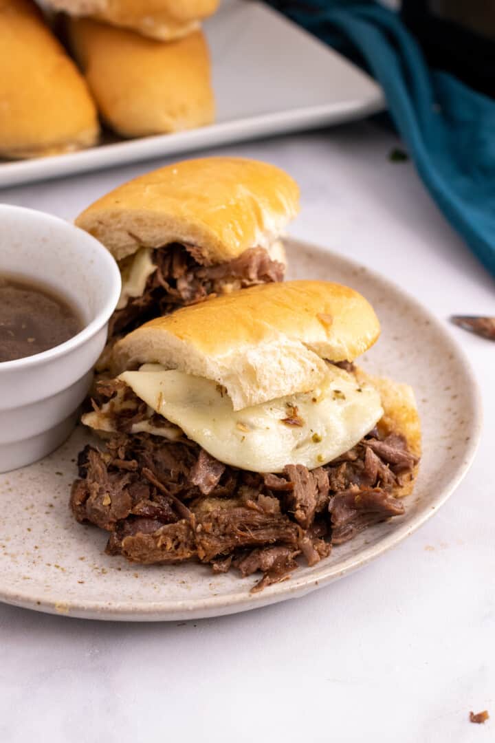 French Dip Sandwich sliced on a plate.