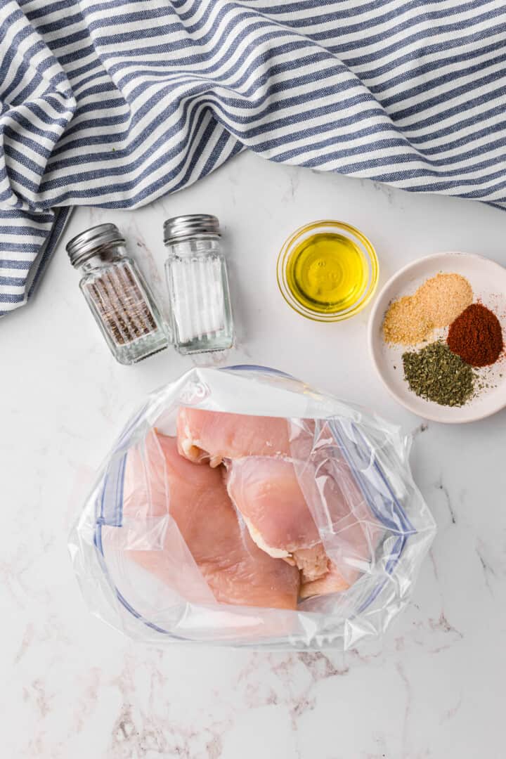 raw chicken breasts in large Ziplock bag.