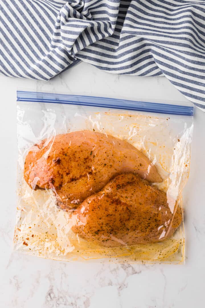 chicken marinating in the baggie.