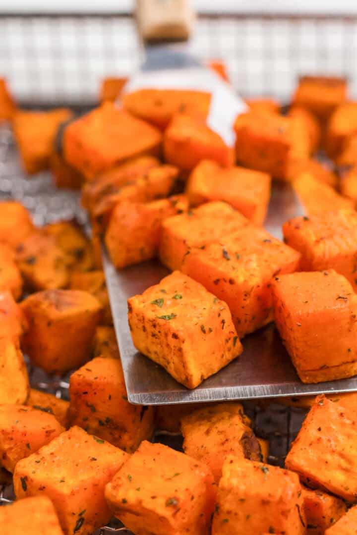 closeup of the sweet potatoes being served on a spatula.