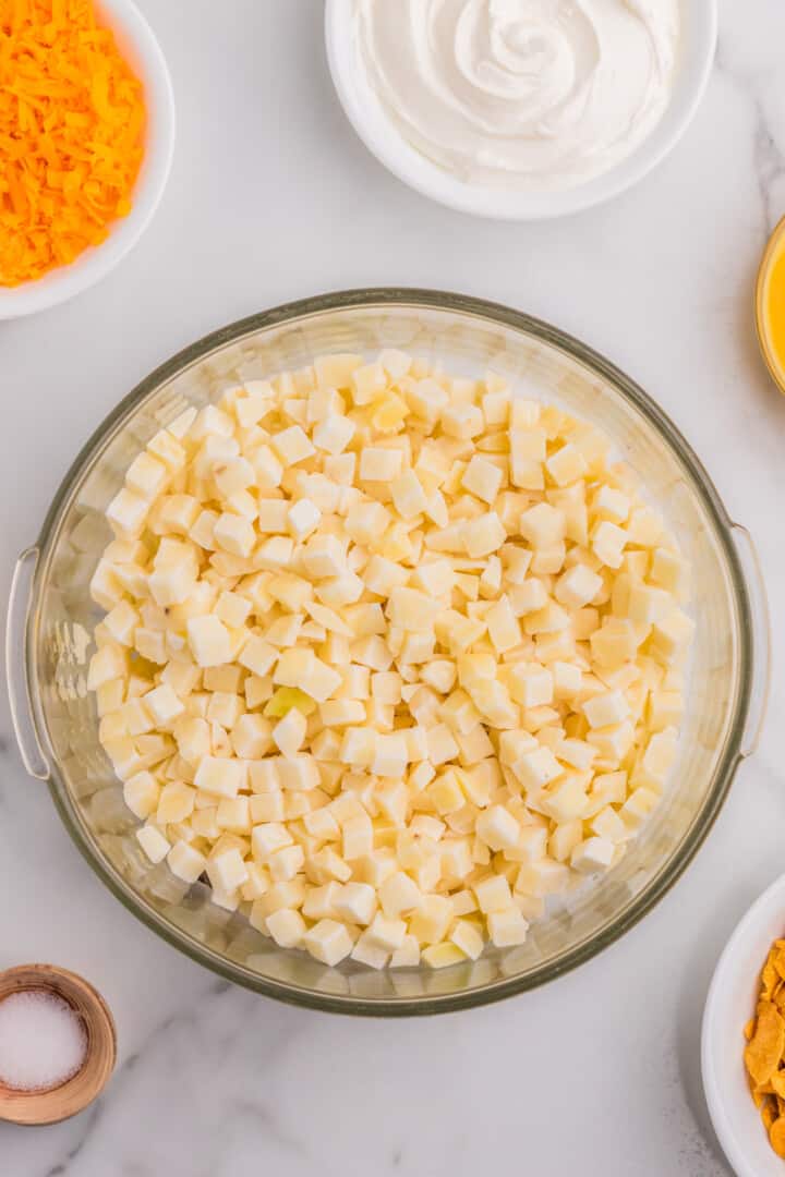 hash browns in a large mixing bowl.