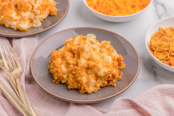 closeup of the funeral potatoes on gray serving plate.