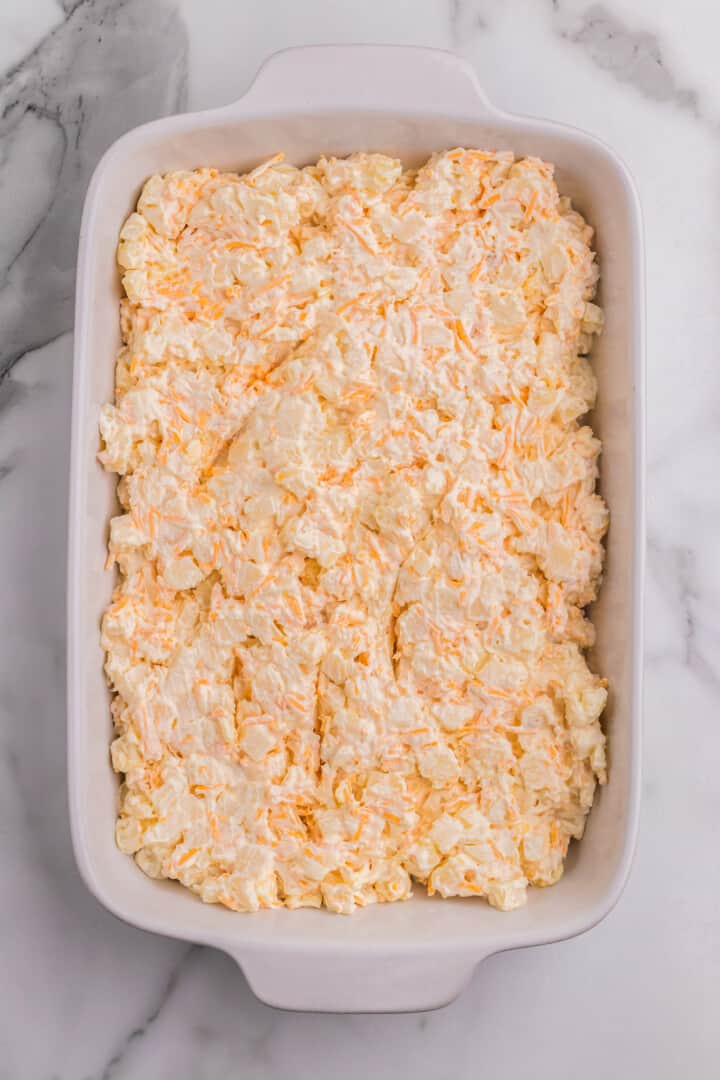 the funeral potatoes in the casserole dish before baking.