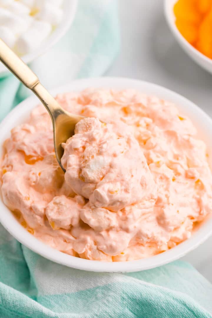 using a metal spoon to serve the Orange Fluff.