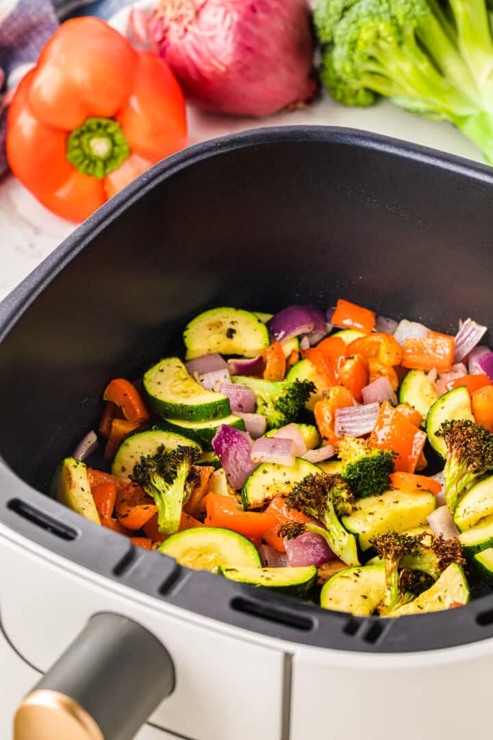 air fryer vegetables in the air fryer basket.