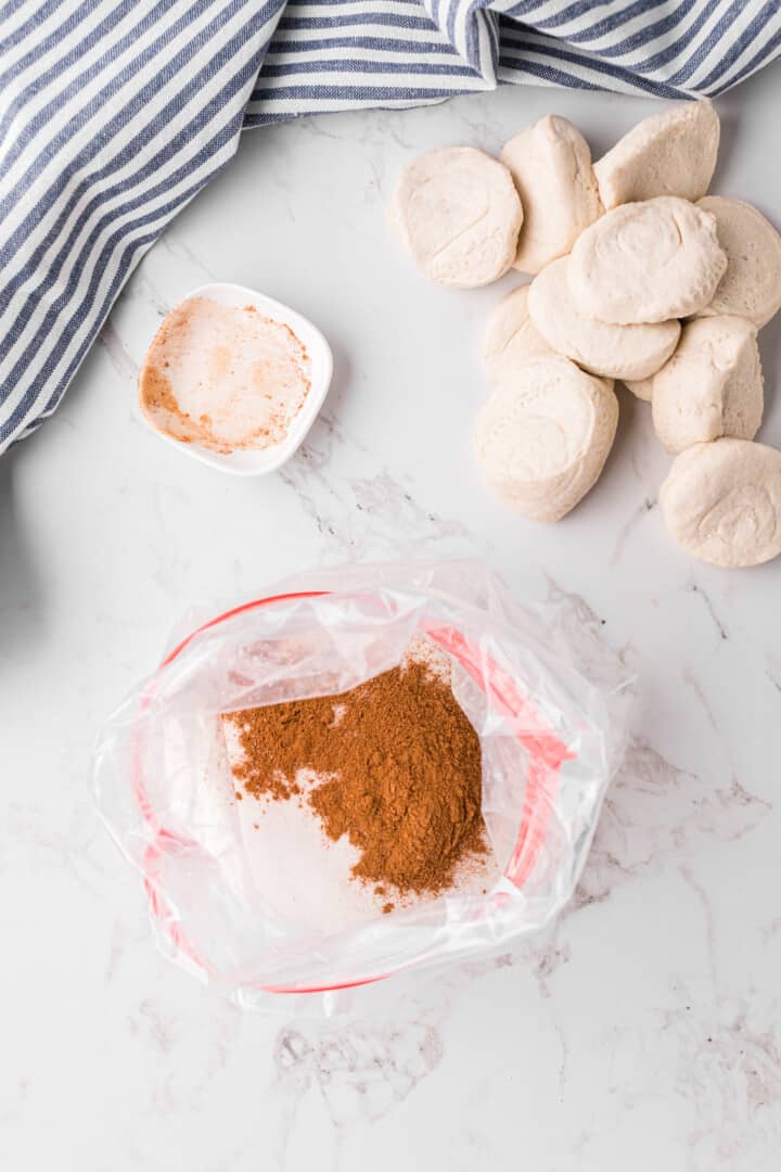 sugar and cinnamon in large baggie to mix biscuits in.