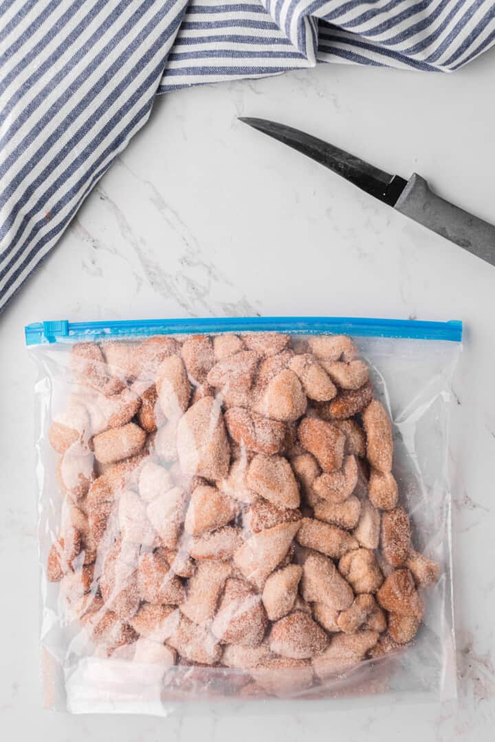 cinnamon sugar coated biscuit pieces in large Ziplock baggie.