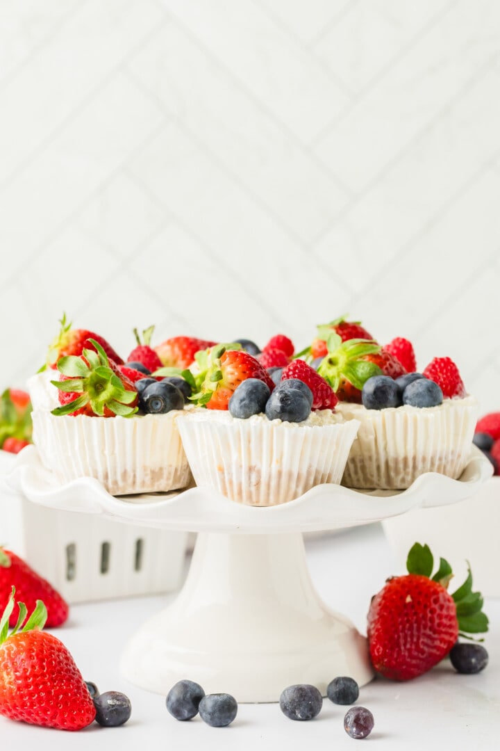 Mini Cheesecakes on white serving tray.