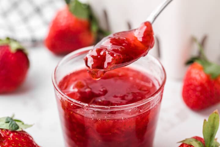 serving the strawberry syrup with a spoon.